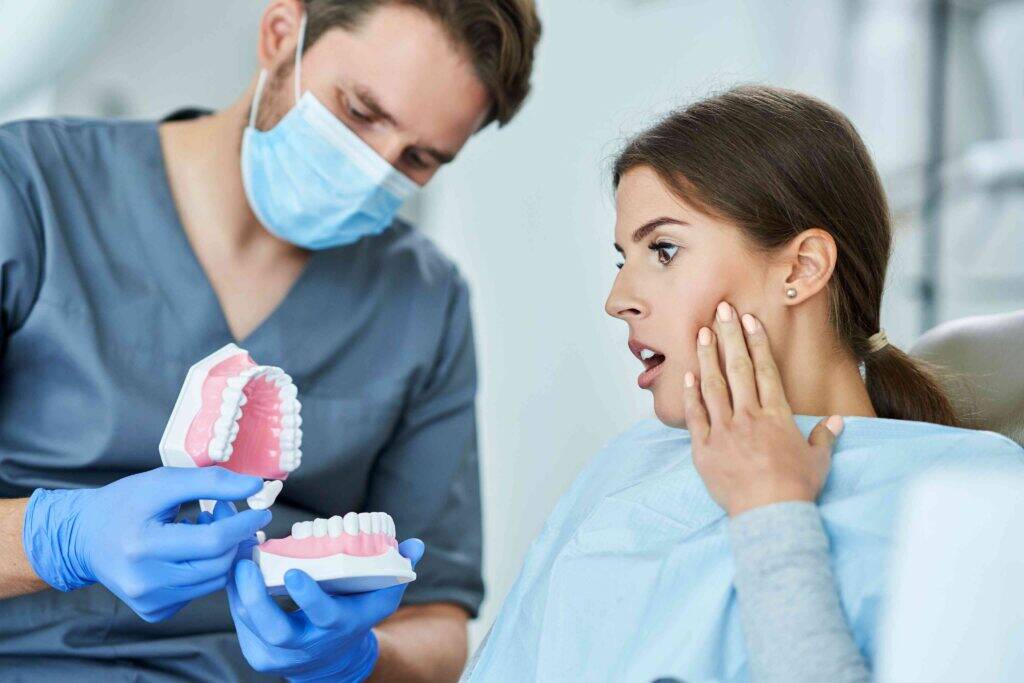 Dentist explaining denture options to a patient.